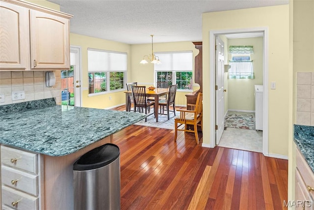 829 Clemson Ave, Fairview Heights, IL 62208 - kitchen with a chandelier, plenty of natural light, dark wood-style flooring, and tasteful backsplash