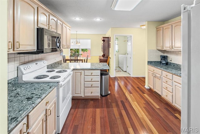 829 Clemson Ave, Fairview Heights, IL 62208 - kitchen with white electric range oven, washing machine and clothes dryer, a peninsula, dark wood finished floors, and tasteful backsplash