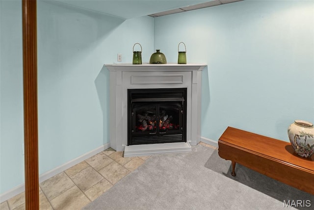 829 Clemson Ave, Fairview Heights, IL 62208 - detailed view of baseboards and a lit fireplace