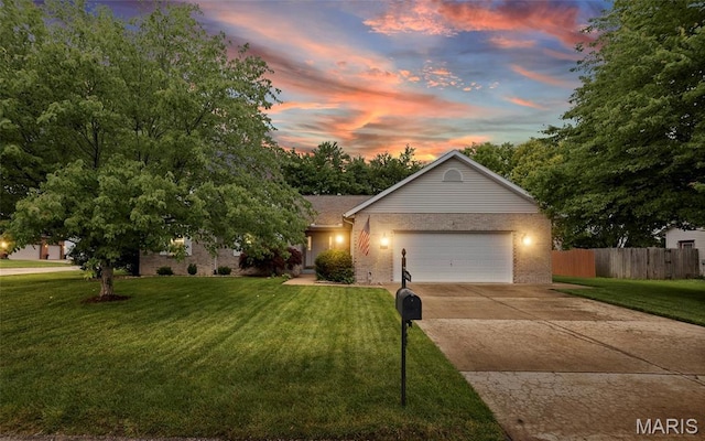 829 Clemson Ave, Fairview Heights, IL 62208 - view of front facade featuring an attached garage, brick siding, and concrete driveway