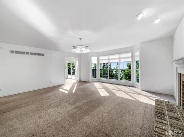 596 Eagle Manor Ln, Chesterfield, MO 63017 - unfurnished living room with a chandelier, carpet floors, and a fireplace