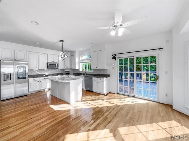 596 Eagle Manor Ln, Chesterfield, MO 63017 - kitchen featuring appliances with stainless steel finishes, white cabinetry, light wood-style flooring, a ceiling fan, and recessed lighting