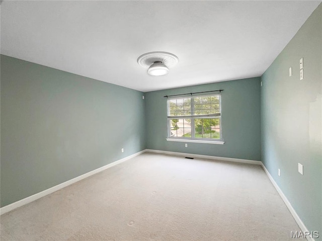 596 Eagle Manor Ln, Chesterfield, MO 63017 - spare room featuring carpet and baseboards