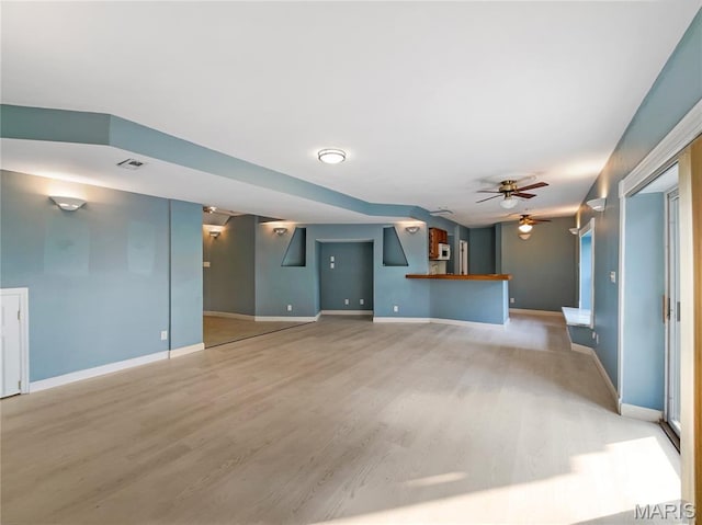 596 Eagle Manor Ln, Chesterfield, MO 63017 - unfurnished living room with light wood-style floors and ceiling fan