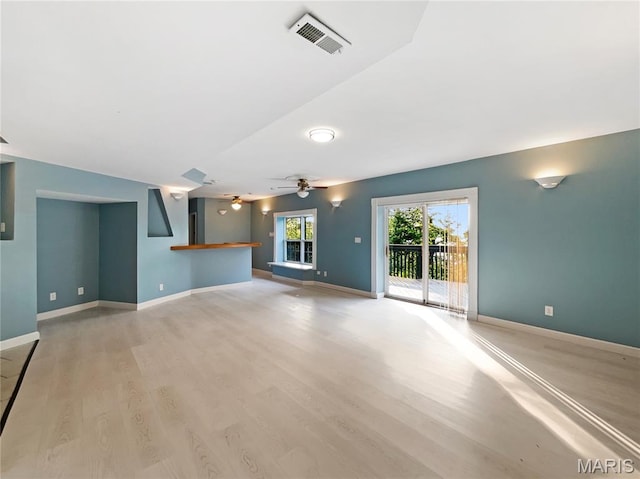596 Eagle Manor Ln, Chesterfield, MO 63017 - unfurnished living room featuring light wood-style floors and ceiling fan