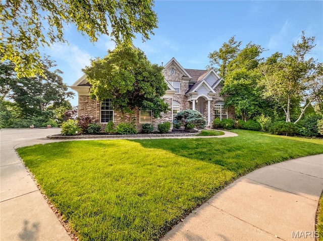 596 Eagle Manor Ln, Chesterfield, MO 63017 - view of property hidden behind natural elements with stone siding and a front yard