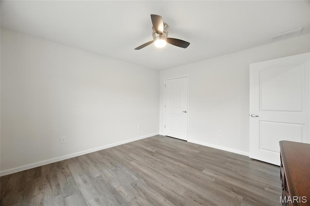 1575 Hickory Lndg, De Soto, MO 63020 - unfurnished bedroom with dark wood finished floors and ceiling fan