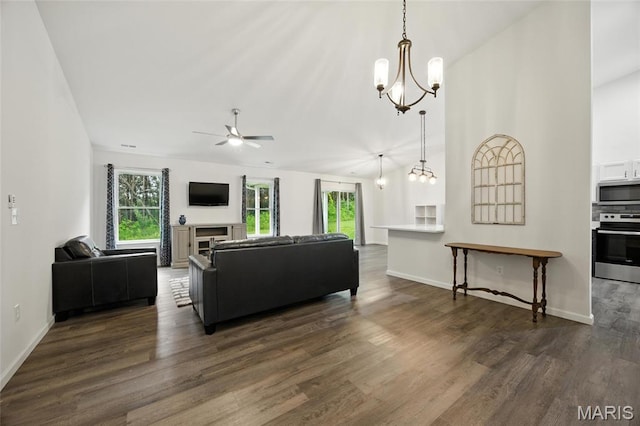 1575 Hickory Lndg, De Soto, MO 63020 - living area featuring a ceiling fan, dark wood finished floors, a chandelier, and vaulted ceiling