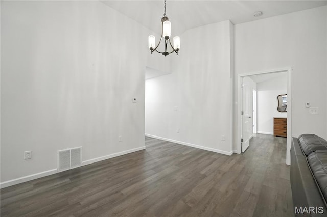 1575 Hickory Lndg, De Soto, MO 63020 - unfurnished dining area with a chandelier and dark wood-style flooring