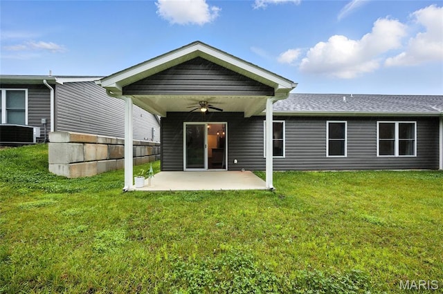 1575 Hickory Lndg, De Soto, MO 63020 - back of property with ceiling fan, a patio area, a yard, and roof with shingles