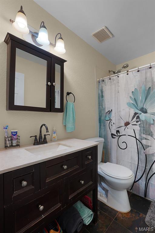 351 Orion Dr, De Soto, MO 63020 - bathroom featuring vanity and a shower with shower curtain