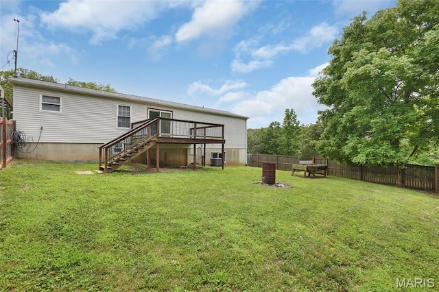 351 Orion Dr, De Soto, MO 63020 - back of house with stairs, a fenced backyard, and a wooden deck