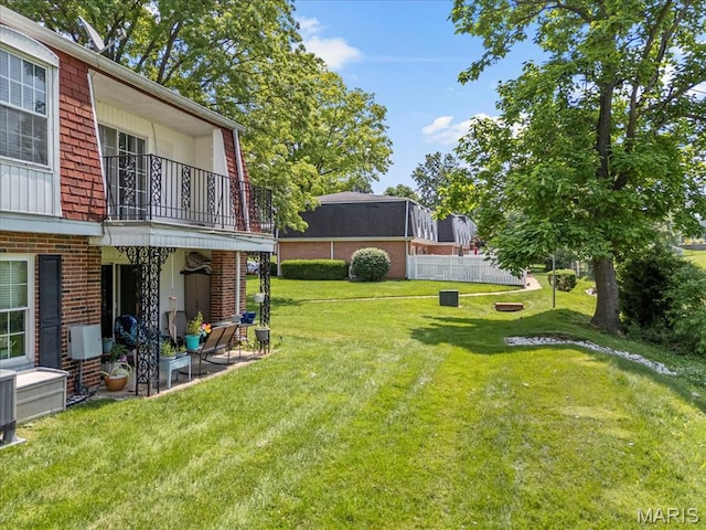 1745 Herault Pl Unit F, Saint Louis, MO 63125 - view of green lawn with a balcony and a patio