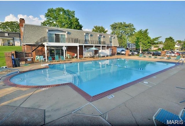 1745 Herault Pl Unit F, Saint Louis, MO 63125 - community pool featuring a patio
