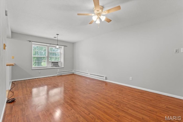 1745 Herault Pl Unit F, Saint Louis, MO 63125 - spare room featuring baseboard heating, ceiling fan, wood finished floors, and cooling unit