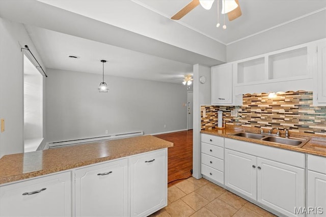 1745 Herault Pl Unit F, Saint Louis, MO 63125 - kitchen featuring baseboard heating, a ceiling fan, open shelves, and tasteful backsplash