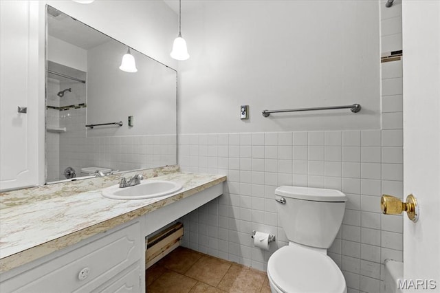 1745 Herault Pl Unit F, Saint Louis, MO 63125 - full bathroom featuring tile walls, vanity, tile patterned floors, a shower, and wainscoting