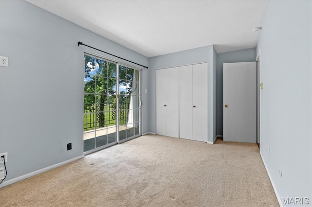 1745 Herault Pl Unit F, Saint Louis, MO 63125 - unfurnished bedroom with access to exterior, carpet floors, and a closet