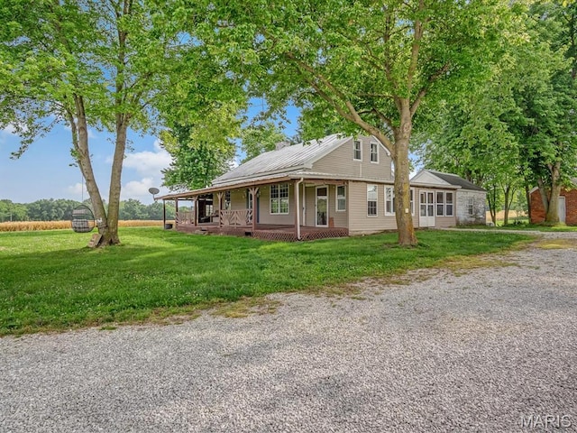 1767 Ames Rd, Prairie Du Rocher, IL 62277 - view of front facade with a porch, a front yard, and gravel driveway