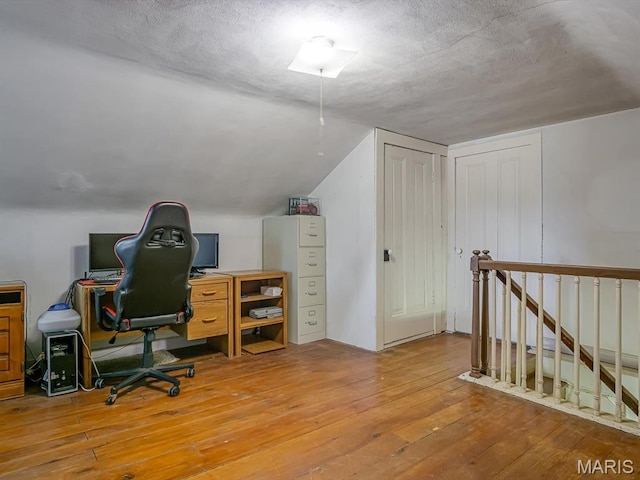 1767 Ames Rd, Prairie Du Rocher, IL 62277 - office area featuring hardwood / wood-style flooring, vaulted ceiling, and a textured ceiling