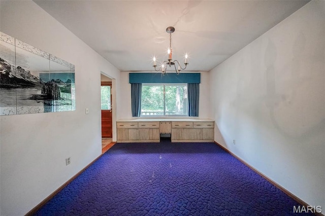 10820 Clayton Ct, Rolla, MO 65401 - unfurnished dining area with a chandelier, dark colored carpet, and radiator