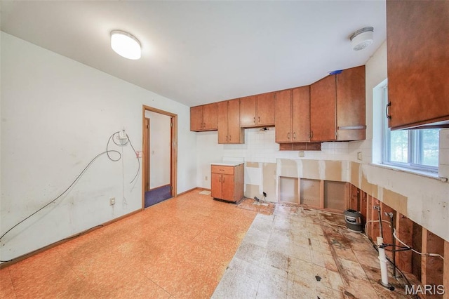 10820 Clayton Ct, Rolla, MO 65401 - kitchen with brown cabinets and light floors