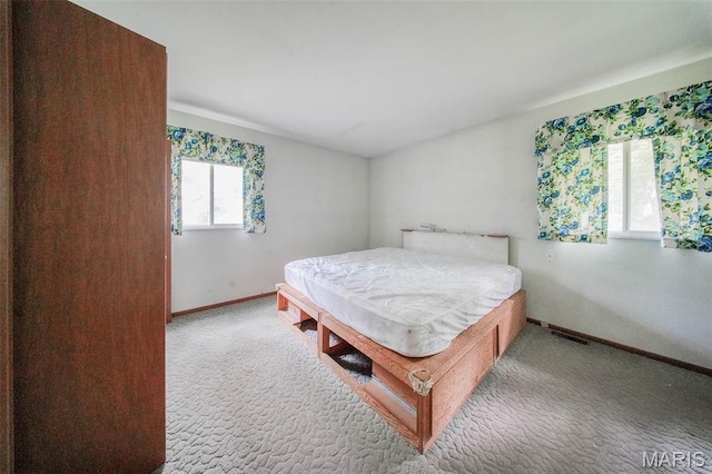 10820 Clayton Ct, Rolla, MO 65401 - carpeted bedroom featuring baseboards