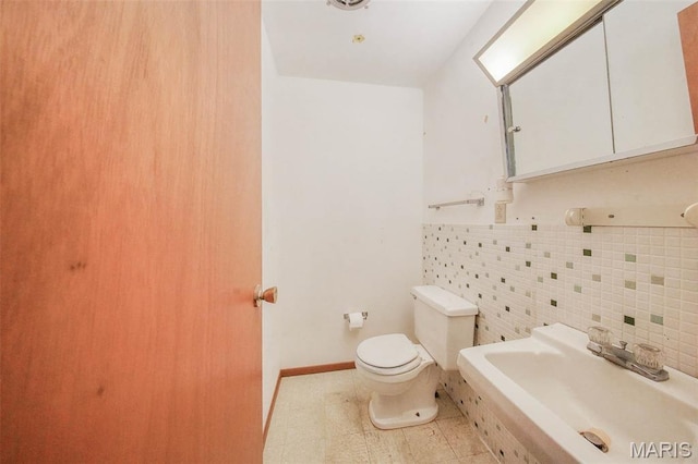10820 Clayton Ct, Rolla, MO 65401 - half bathroom with tile walls and tile patterned floors