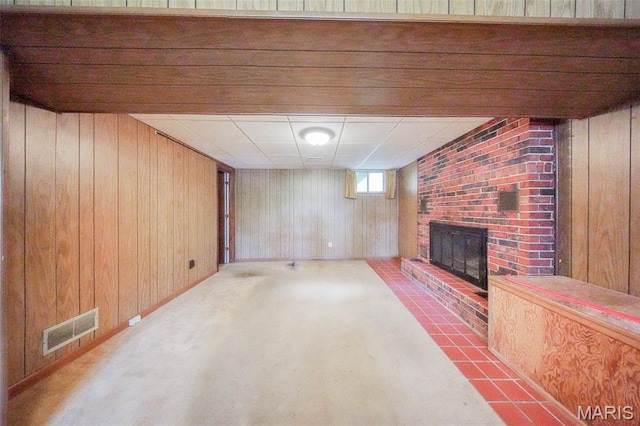 10820 Clayton Ct, Rolla, MO 65401 - below grade area with wood walls and a fireplace