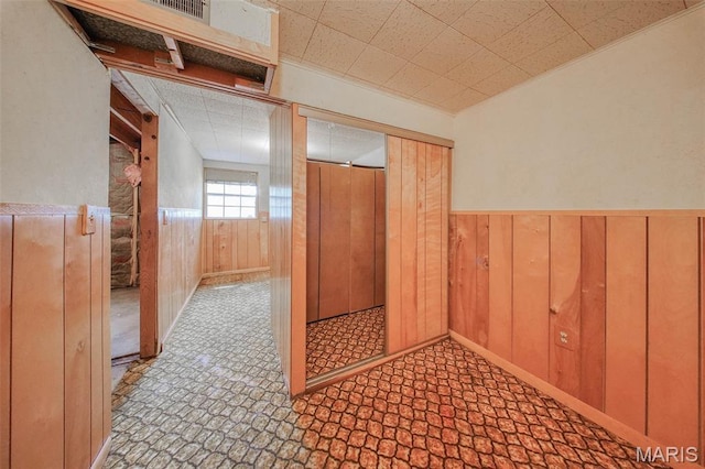 10820 Clayton Ct, Rolla, MO 65401 - corridor with wainscoting and wooden walls