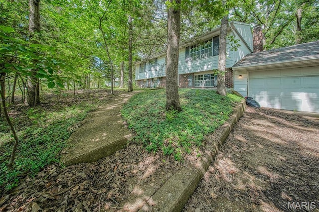 10820 Clayton Ct, Rolla, MO 65401 - view of yard featuring a garage