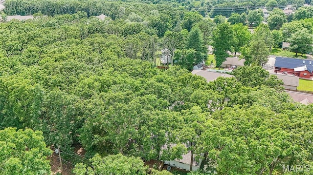 10820 Clayton Ct, Rolla, MO 65401 - aerial view of property and surrounding area with a heavily wooded area