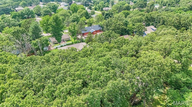 10820 Clayton Ct, Rolla, MO 65401 - aerial view of property and surrounding area featuring a heavily wooded area