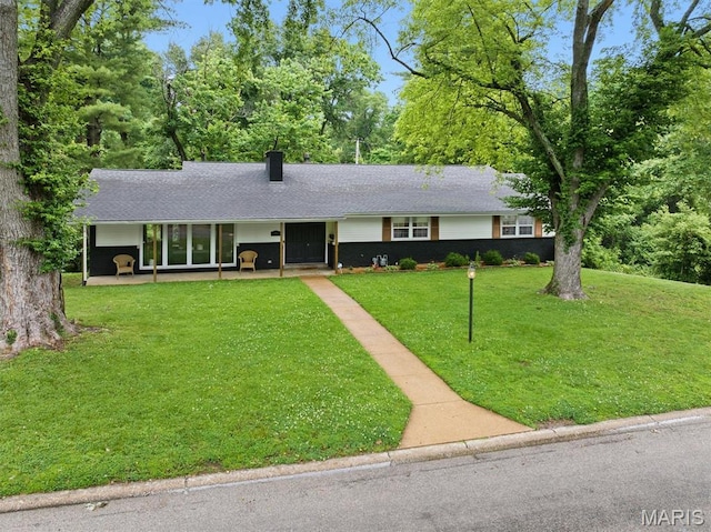 101 E Fairway Dr, Belleville, IL 62223 - ranch-style home featuring a front yard, a chimney, and a patio area