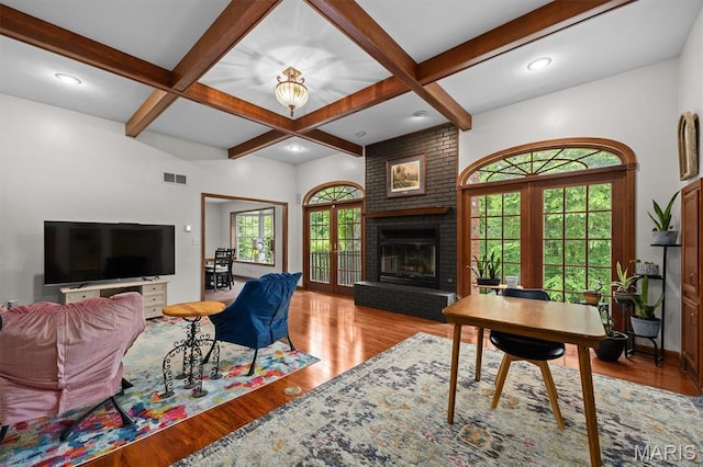 101 E Fairway Dr, Belleville, IL 62223 - living area featuring plenty of natural light, beamed ceiling, a fireplace, wood finished floors, and coffered ceiling