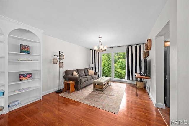 101 E Fairway Dr, Belleville, IL 62223 - living area with wood finished floors, a chandelier, and built in features