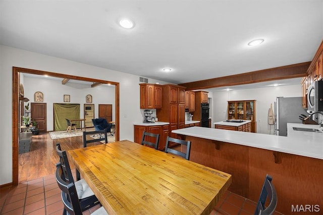 101 E Fairway Dr, Belleville, IL 62223 - tiled dining space with a sink and recessed lighting