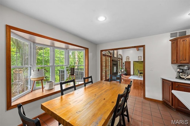101 E Fairway Dr, Belleville, IL 62223 - tiled dining space featuring baseboards