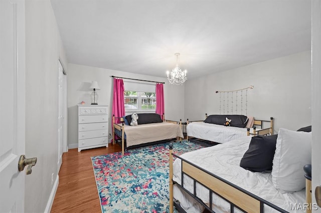 101 E Fairway Dr, Belleville, IL 62223 - bedroom featuring a chandelier and wood finished floors
