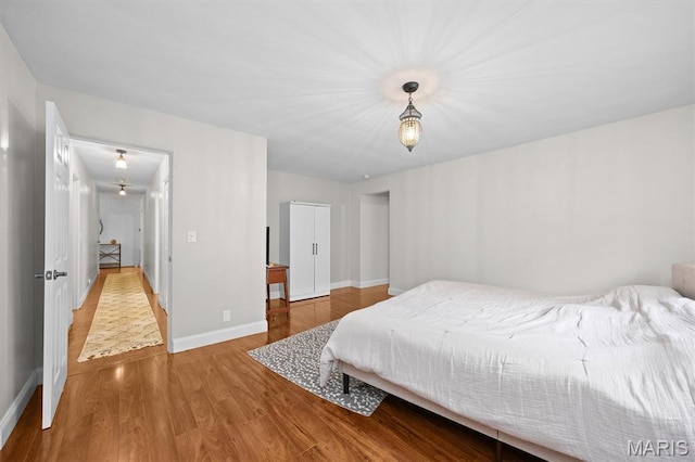 101 E Fairway Dr, Belleville, IL 62223 - bedroom featuring wood finished floors and baseboards