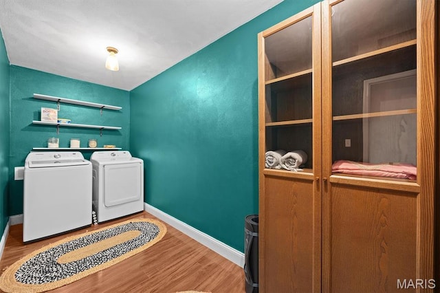 101 E Fairway Dr, Belleville, IL 62223 - laundry area featuring wood finished floors and washer and dryer