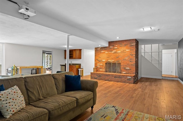 101 E Fairway Dr, Belleville, IL 62223 - living area with a brick fireplace, light wood-style flooring, and recessed lighting