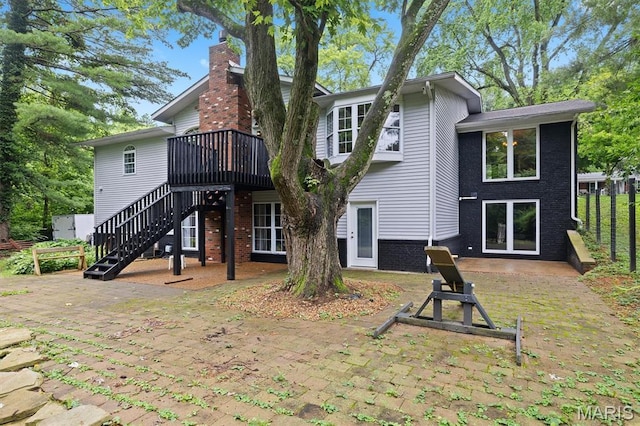 101 E Fairway Dr, Belleville, IL 62223 - back of property featuring a patio area, stairs, brick siding, a wooden deck, and a chimney