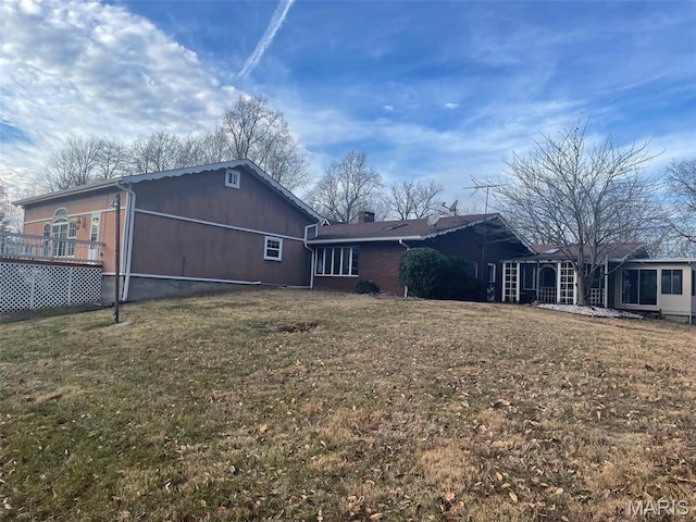 12746 Rolling Hills Dr, Trenton, IL 62293 - rear view of house with a lawn and a chimney