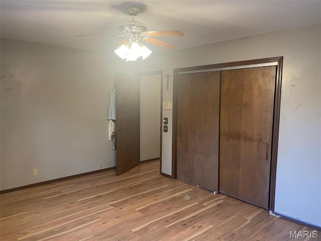 12746 Rolling Hills Dr, Trenton, IL 62293 - unfurnished bedroom featuring light wood finished floors, a closet, and ceiling fan