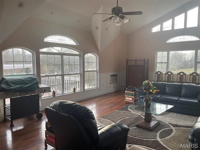 12746 Rolling Hills Dr, Trenton, IL 62293 - living area featuring wood finished floors, wainscoting, ceiling fan, high vaulted ceiling, and a wall mounted AC