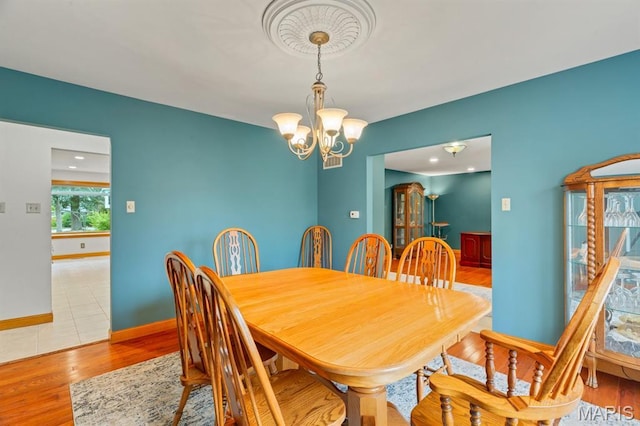 10 Rio Vista Dr, Frontier Township, MO 63303 - dining area featuring a chandelier and light wood finished floors