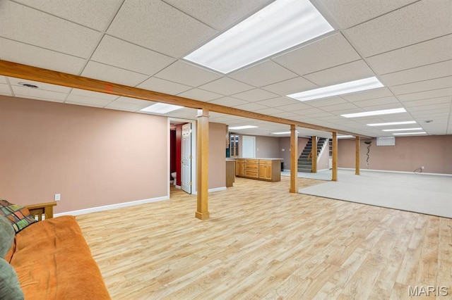 10 Rio Vista Dr, Frontier Township, MO 63303 - finished basement with light wood-style floors, a paneled ceiling, and stairs