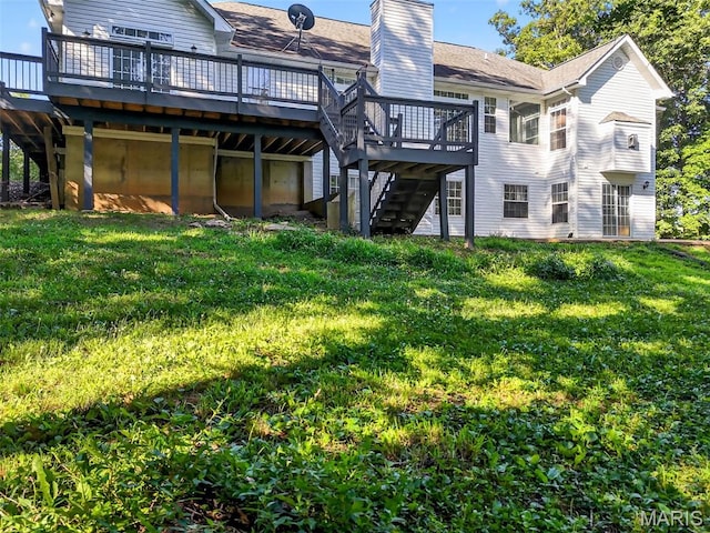 23827 Falcon Ridge Rd, Warrenton, MO 63383 - rear view of house with stairway, a deck, a lawn, and a chimney