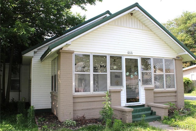 111 W Broadway St, Hayti, MO 63851 - bungalow with brick siding and a sunroom